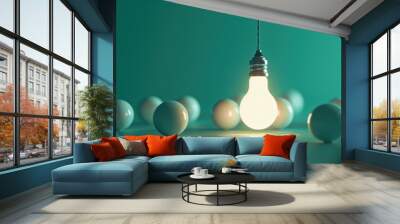 a glowing light bulb hanging from a cord, surrounded by several unlit light bulbs lying on a smooth surface Wall mural